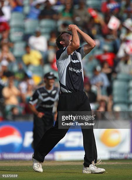 Ian Butler of New Zealand celebrates taking the wicket of Shoaib Malik of Pakistan during the ICC Champions Trophy 2nd Semi Final match between New...