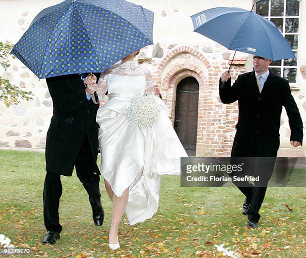 Barbara Schoeneberger leaves her church wedding with Maximilian von Schierstaedt at the church of Rambow on October 3, 2009 in Rambow, Germany.