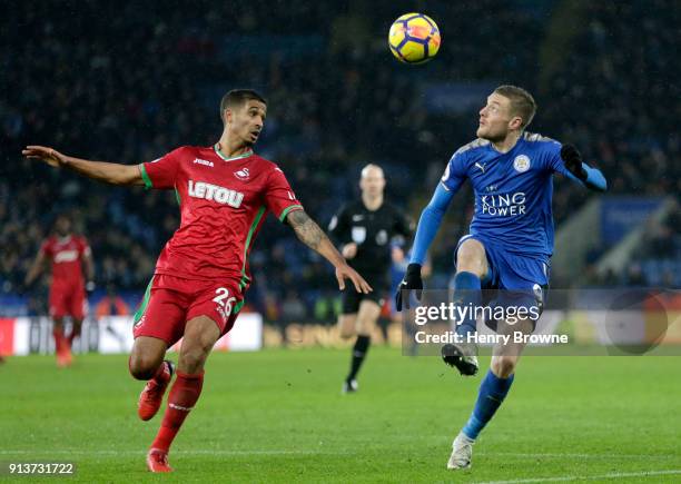 Kyle Naughton of Swansea City battles for possesion with Jamie Vardy of Leicester City during the Premier League match between Leicester City and...