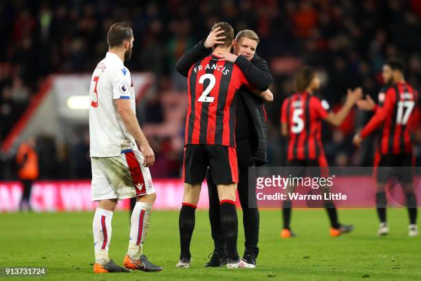 Eddie Howe, Manager of AFC Bournemouth embraces Simon Francis of AFC Bournemouth following the Premier League match between AFC Bournemouth and Stoke...