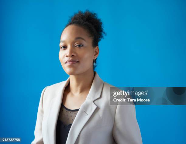 portrait of young business woman - woman blue background stock pictures, royalty-free photos & images