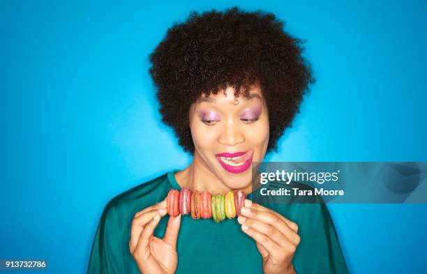 woman with colourful macarons - human tongue foto e immagini stock