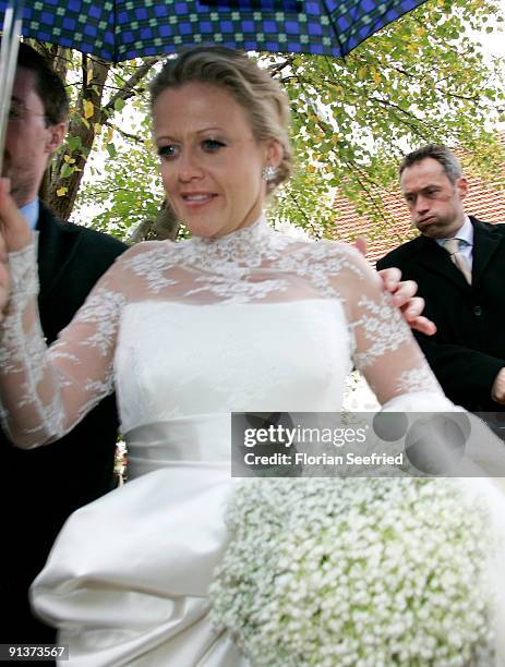 Barbara Schoeneberger leaves her church wedding with Maximilian von Schierstaedt at the church of Rambow on October 3, 2009 in Rambow, Germany.