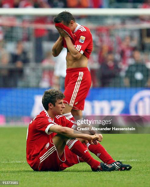 Thomas Mueller of Muenchen and his team mate Ivica Olic react after the Bundesliga match between FC Bayern Muenchen and 1. FC Koeln at Allianz Arena...