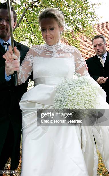 Barbara Schoeneberger leaves her church wedding with Maximilian von Schierstaedt at the church of Rambow on October 3, 2009 in Rambow, Germany.