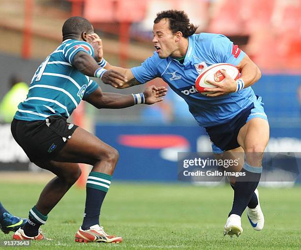 Trompie Nontshinga of GWK Griquas looks to tackle Francois Hougaard of the Bulls during the Absa Currie Cup match between Blue Bulls and GWK Griquas...