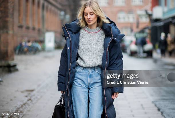 Lisa Hahnbueck wearing navy Tommy Hilfiger x Gigi Hadid down feather jacket coat, Victoria Beckham knit, Goldsign denim jeans, Mai Piu Senza velvet...