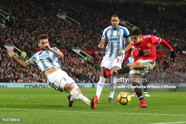 Alexis Sanchez of Man Utd has his shot blocked by Tommy Smith of Huddersfield during the Premier League match between Manchester United and...