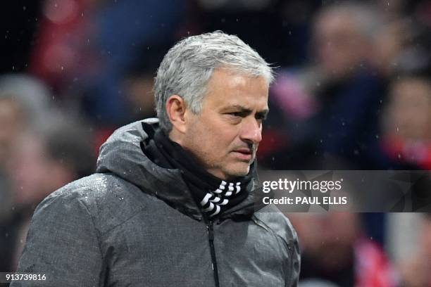 Manchester United's Portuguese manager Jose Mourinho leaves the pitch at the end of the English Premier League football match between Manchester...