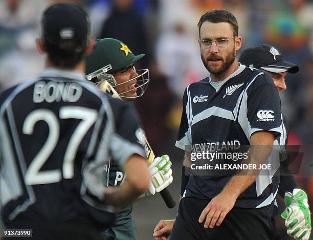 New Zealand's bowler and captain Daniel Vettori celebrates the dissmisal of Pakistan's batsman Kamran Akmal during ICC Champions Trophy 2nd semi...