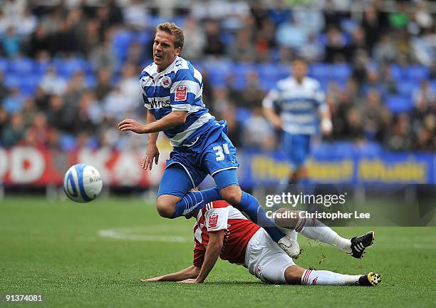 Brian Howard of Reading is tackled by Gary O'Neil of Middlesbrough during the Coca-Cola Championship match between Reading and Middlesbrough at the...