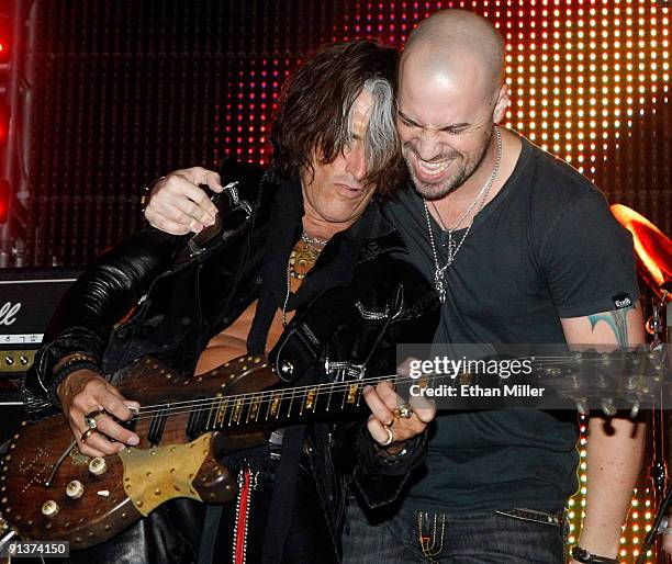 Aerosmith guitarist Joe Perry and Daughtry frontman Chris Daughtry perform during a concert at the Bare Pool Lounge at The Mirage Hotel & Casino to...