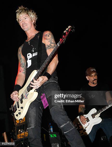 Bassist Duff McKagan and guitarist Dave Kushner perform during a concert at the Bare Pool Lounge at The Mirage Hotel & Casino to celebrate the...