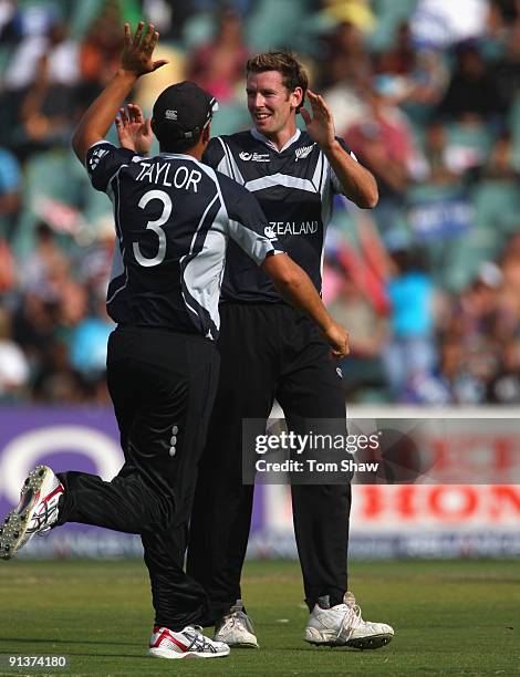 Ian Butler of New Zealand celebrates taking the wicket of Shoaib Malik of Pakistan during the ICC Champions Trophy 2nd Semi Final match between New...