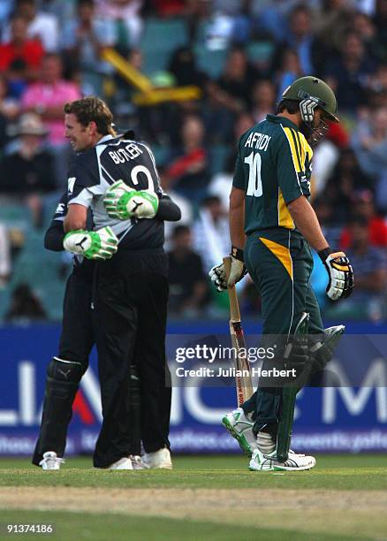 Ian Butler and Brendon McCullum of New Zealand celebrate the wicket of Shahid Afridi during The 2nd ICC Champions Trophy Semi Final between New...