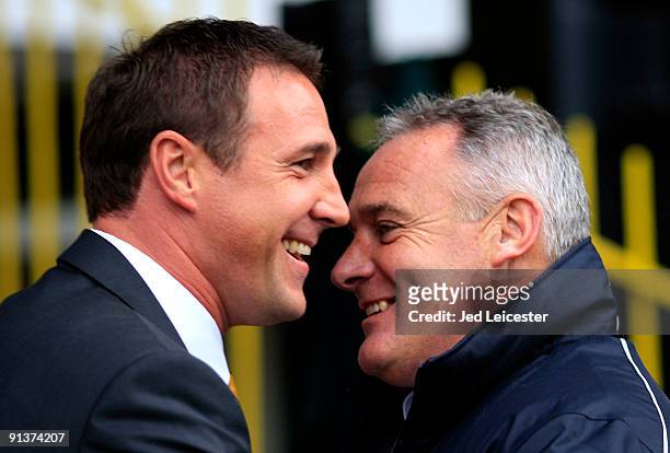 Cardiff City's Dave Jones and Watford's Malcy MacKay smile during the Watford and Cardiff City Coca Cola Championship match at Vicarage Road on...