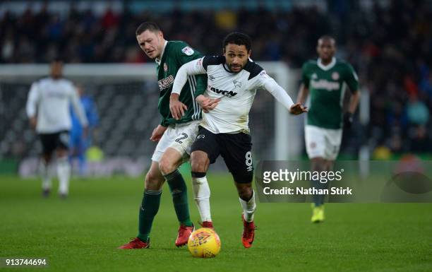 Ikechi Anya of Derby County and Henrik Dalsgaard of Brentford in action during the Sky Bet Championship match between Derby County and Brentford at...