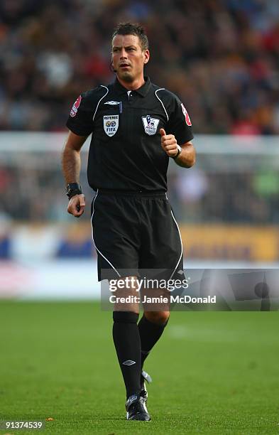 Referee Mark Clattenburg looks on during the Barclays Premier League match between Hull City and Wigan Athletic at KC Stadium on October 3, 2009 in...