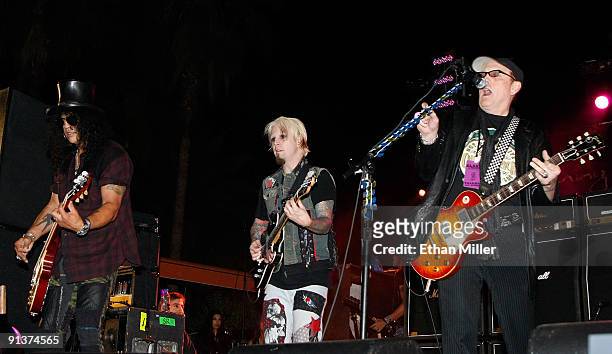 Guitarists Slash, John 5 and Cheap Trick's Rick Nielsen perform during a concert at the Bare Pool Lounge at The Mirage Hotel & Casino to celebrate...