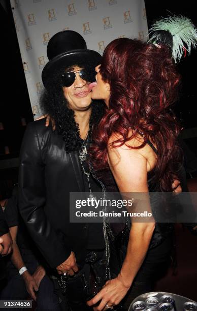 Slash and Perla Hudson attend Jet Nightclub at The Mirage on October 2, 2009 in Las Vegas, Nevada.