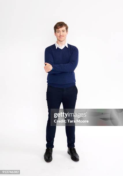 man standing - blue sweater stockfoto's en -beelden