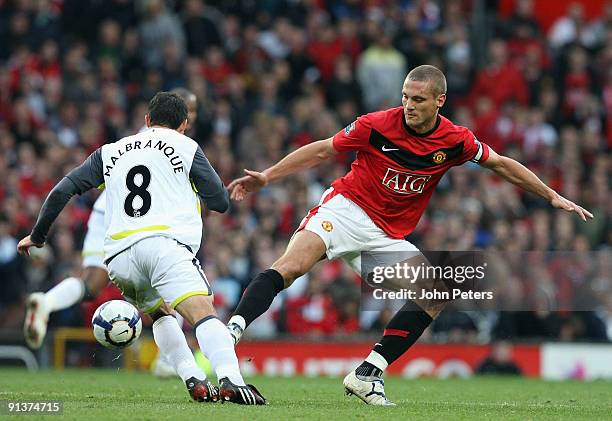 Nemanja Vidic of Manchester United clashes with Steed Malbranque of Sunderland during the FA Barclays Premier League match between Manchester United...