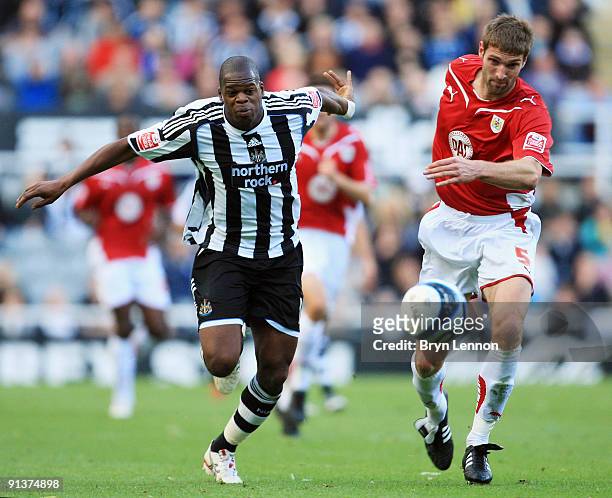Jamie McCombe of Bristol City challenges Marlon Harewood of Newcastle United during the Coca-Cola Championship match between Newcastle United and...