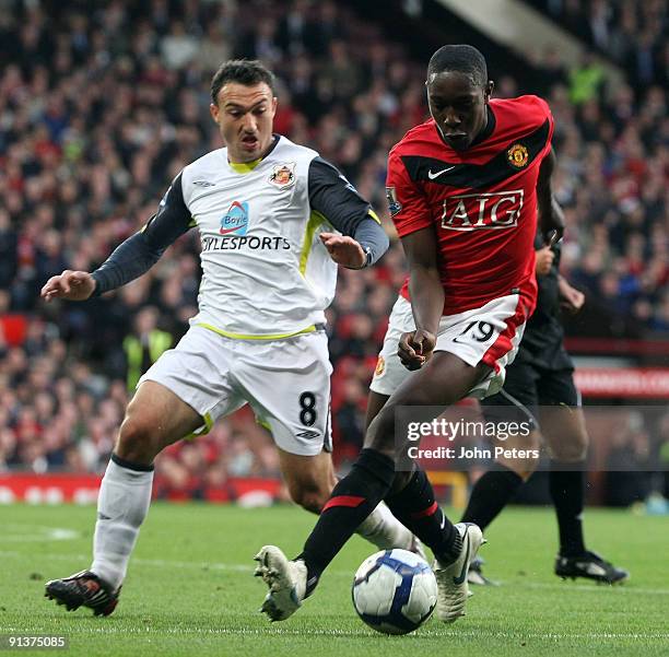 Danny Welbeck of Manchester United clashes with Steed Malbranque of Sunderland during the FA Barclays Premier League match between Manchester United...