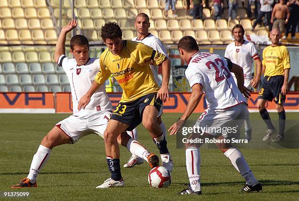 Andrea Catellani of Modena FC is challenged by Simone Rizzato of Reggina Calcio during the match of Serie B between Modena FC and Reggina Calcio at...