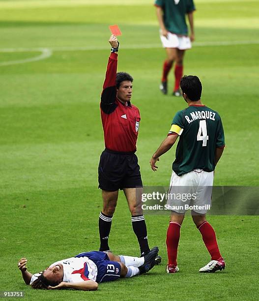 Rafael Marquez of Mexico is sent off by referee Vitor Melo Pereira for a foul on Cobi Jones of the USA during the Mexico v USA, World Cup Second...