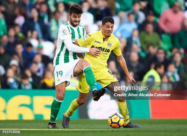 Antonio Barragan of Real Betis Balompie competes for the ball with Pablo Fornals of Villarreal CF during the La Liga match between Real Betis and...