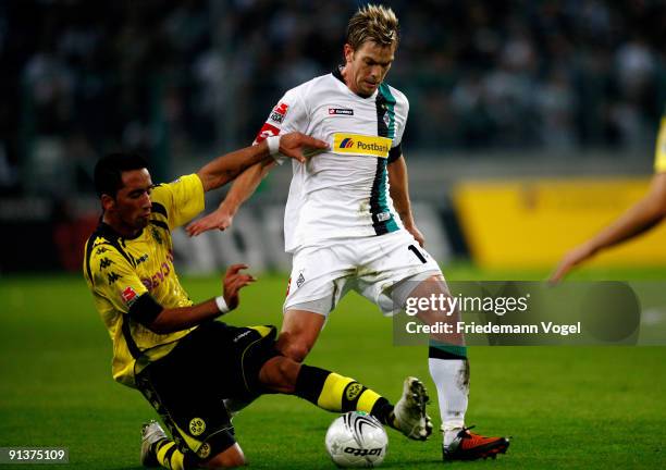 Lucas Barrios of Dortmund battles for the ball with Thorben Marx of Moenchengladbach during the Bundesliga match between Borussia Moenchengladbach...
