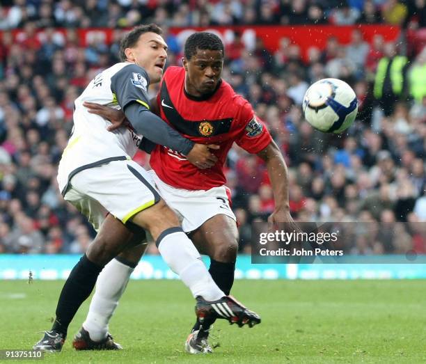 Patrice Evra of Manchester United clashes with Steed Malbranque of Sunderland during the FA Barclays Premier League match between Manchester United...