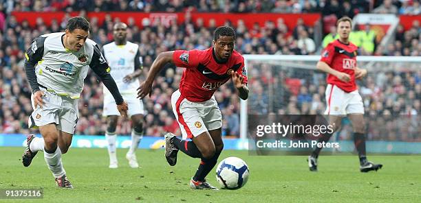 Patrice Evra of Manchester United clashes with Steed Malbranque of Sunderland during the FA Barclays Premier League match between Manchester United...