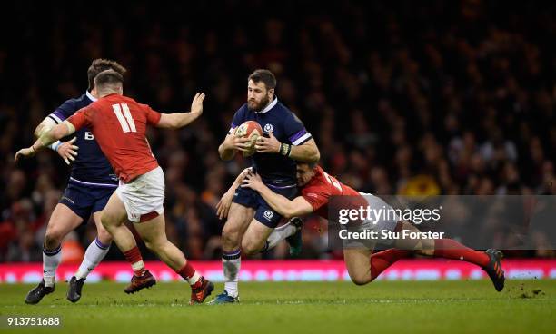 Scotland wing Tommy Seymour is brought down by Wales player Owen Watkin during the NatWest 6 Nations game between Wales and Scotland at Principality...
