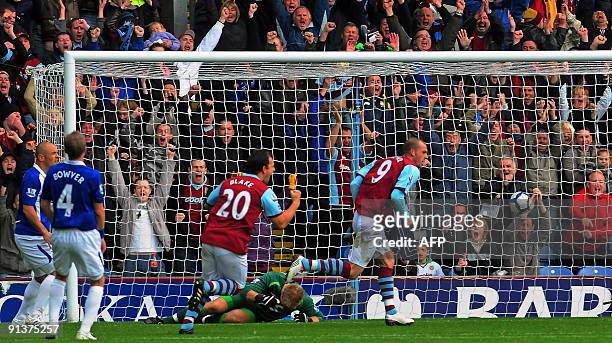 Burnley's Scottish player Steven Fletcher scores during the English Premier League football match between Burnley and Birmingham City at Turf Moor,...