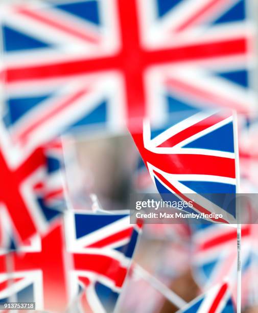 Children wave Union Flags ahead of a visit by Catherine, Duchess of Cambridge to The Wimbledon Junior Tennis Initiative at Bond Primary School on...