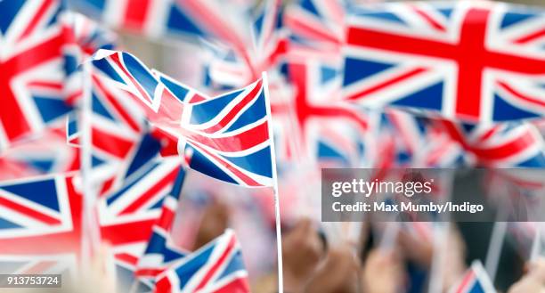 Children wave Union Flags ahead of a visit by Catherine, Duchess of Cambridge to The Wimbledon Junior Tennis Initiative at Bond Primary School on...