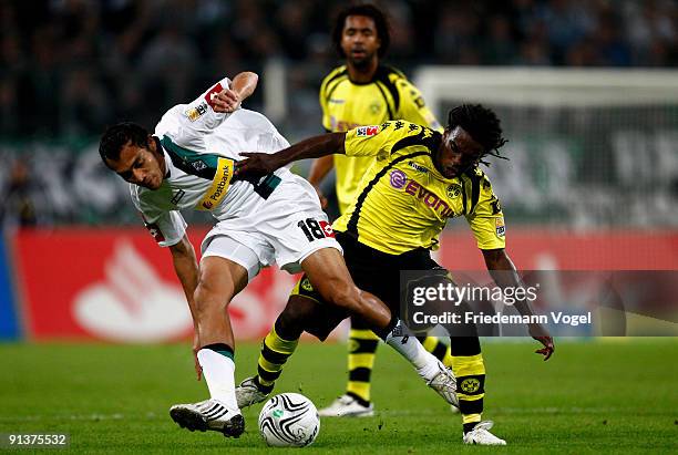 Tinga of Dortmund battles for the ball with Juan Arango of Moenchengladbach during the Bundesliga match between Borussia Moenchengladbach and...