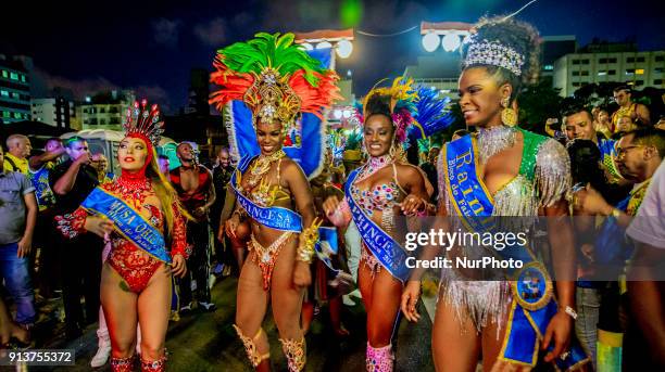 Revelers pose during street Carnival celebrations. Street carnival in Sao Paulo, many groups, called blocos, has bands and thousands of revelers ,...