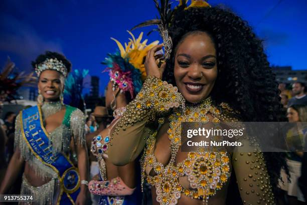 Revelers pose during street Carnival celebrations. Street carnival in Sao Paulo, many groups, called blocos, has bands and thousands of revelers ,...