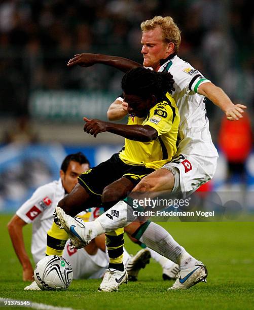 Tinga of Dortmund battles for the ball with Tobias Levels and Juan Arango of Moenchengladbach during the Bundesliga match between Borussia...