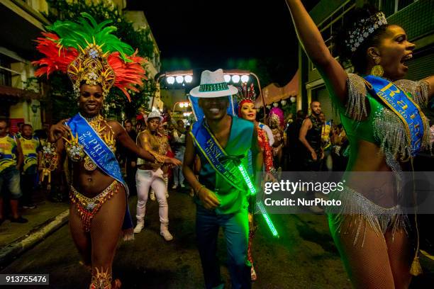 Revelers pose during street Carnival celebrations. Street carnival in Sao Paulo, many groups, called blocos, has bands and thousands of revelers ,...