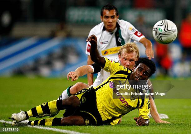 Tinga of Dortmund battles for the ball with Tobias Levels and Juan Arango of Moenchengladbach during the Bundesliga match between Borussia...