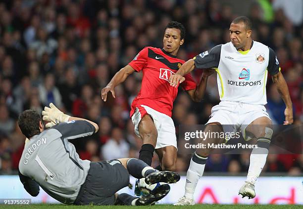 Nani of Manchester United clashes with Anton Ferdinand and Craig Gordon of Sunderland during the Barclays Premier League match between Manchester...