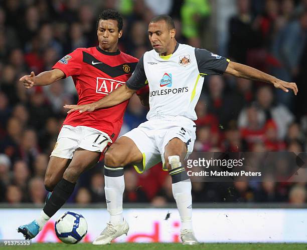 Nani of Manchester United clashes with Anton Ferdinand of Sunderland during the Barclays Premier League match between Manchester United and...