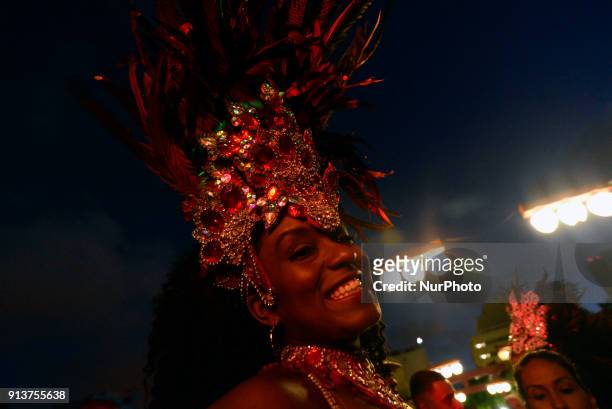 Revelers pose during street Carnival celebrations. Street carnival in Sao Paulo, many groups, called blocos, has bands and thousands of revelers ,...