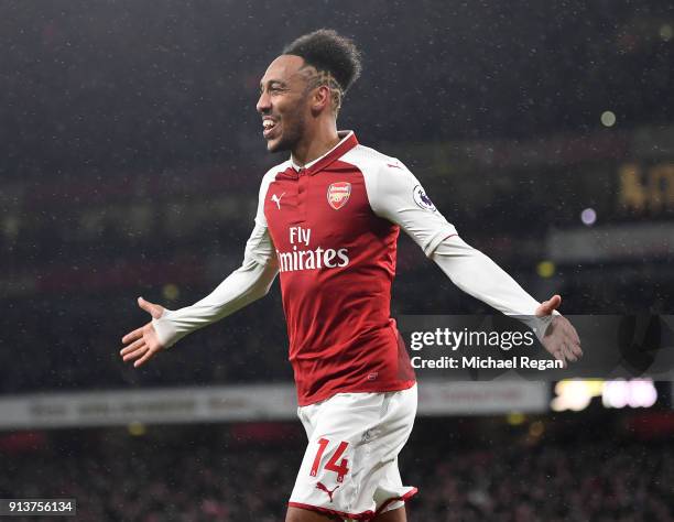 Pierre-Emerick Aubameyang of Arsenal celebrates after scoring his sides fourth goal during the Premier League match between Arsenal and Everton at...