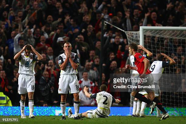 Lee Cattermole of Sunderland and Jordan Henderson show their dejection after Anton Ferdinand scored an own goal during the Barclays Premier League...