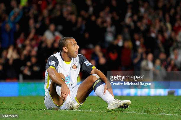 Anton Ferdinand of Sunderland shows his dejection after he scored an own goal during the Barclays Premier League match between Manchester United and...